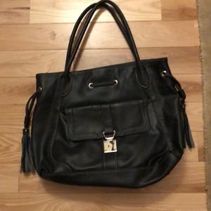 Black shoulder bag with tassels